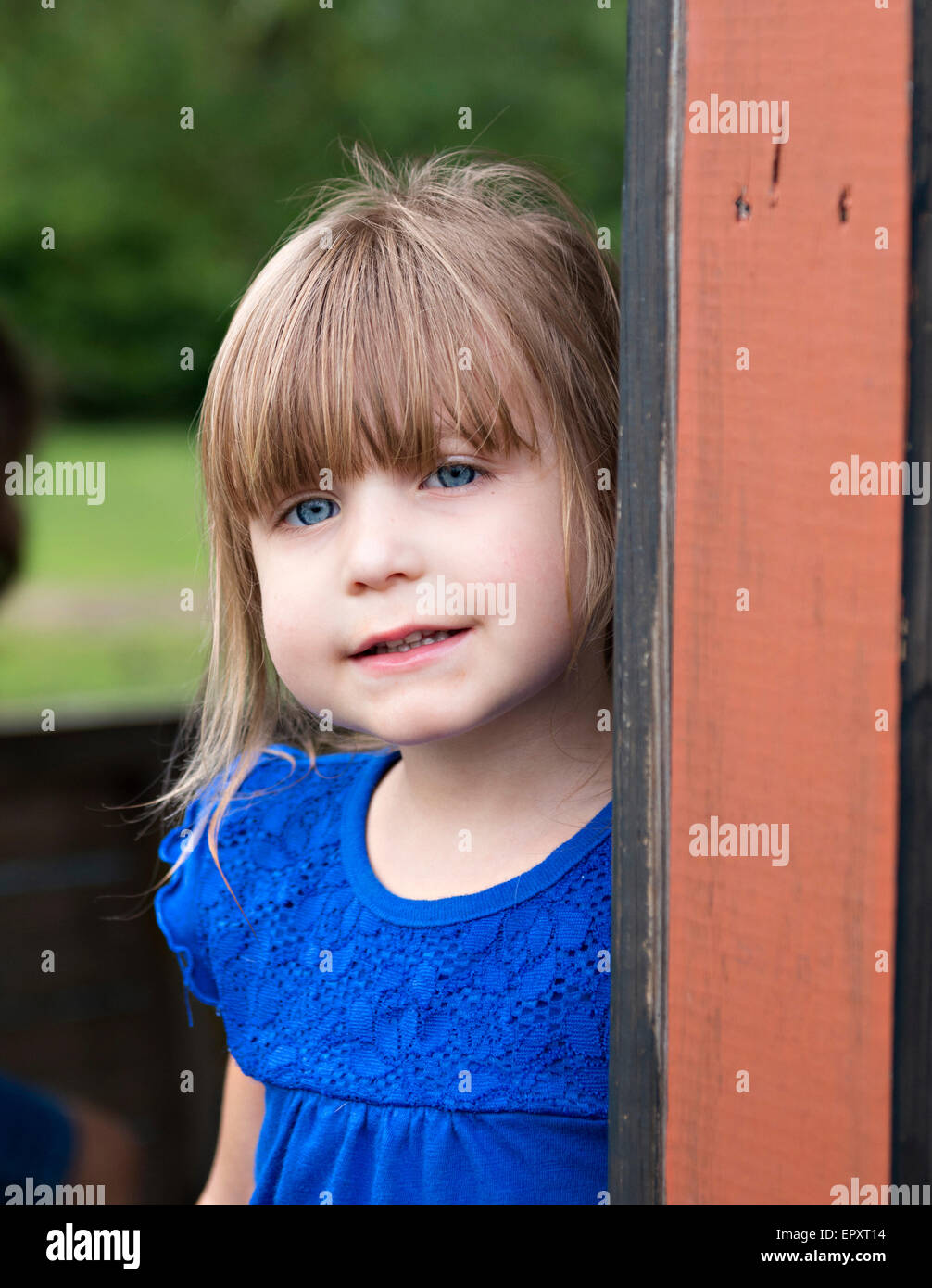 Outdoor portrait of brown hair blue eye child Stock Photo
