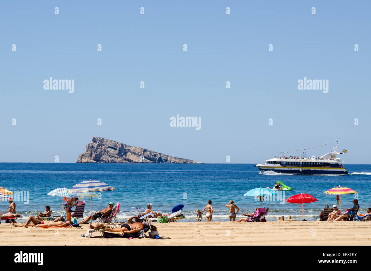 BENIDORM, SPAIN - MAY15, 2015: First summery day of the season on Benidorm beach. Benidorm is the largest tourist resort in Spai Stock Photo
