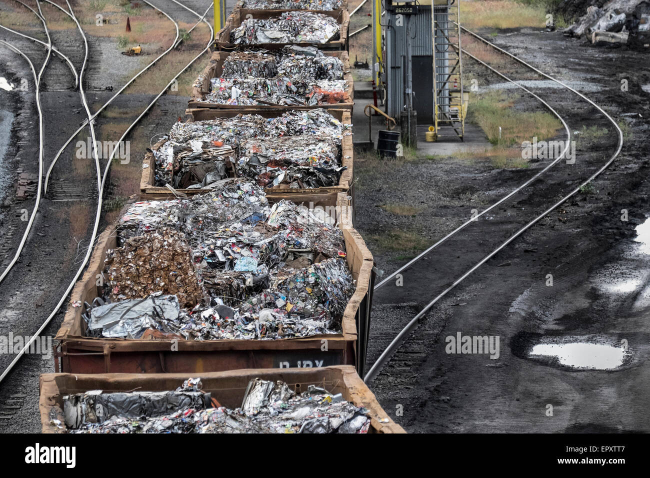 United States, Washington, Seattle, Nucor Bar Mill, scrap metal being taken into the mill by train Stock Photo