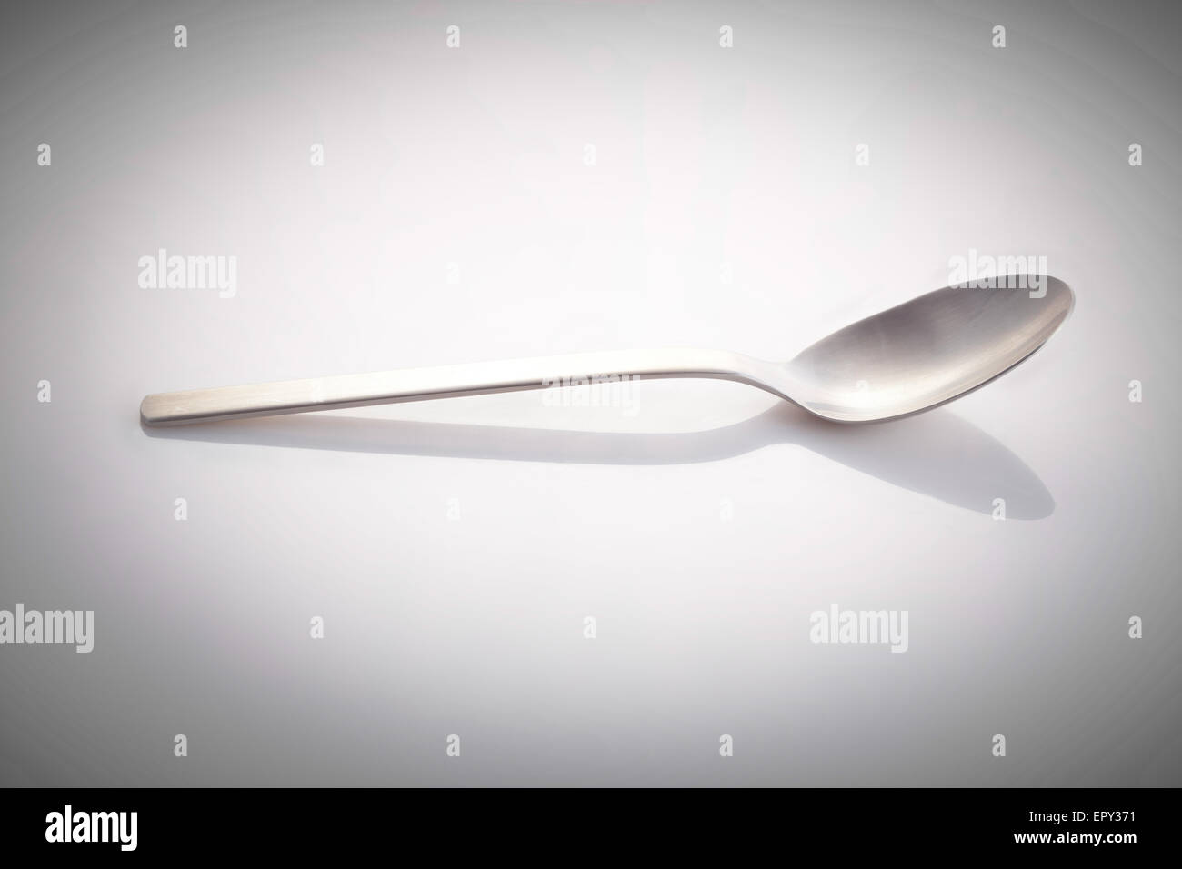empty silver spoon isolated on a white background Stock Photo