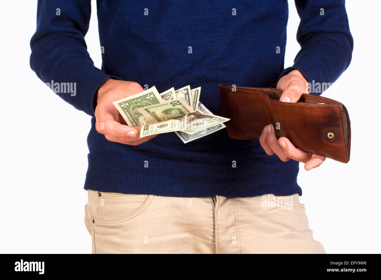 Man Holding a Wallet and Counting Dollar Bills Stock Photo