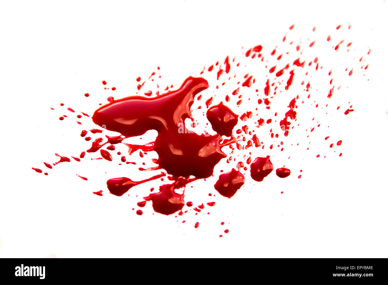 Blood stains (puddle, pool, splatter, smear) isolated on white background close up, horizontal Stock Photo