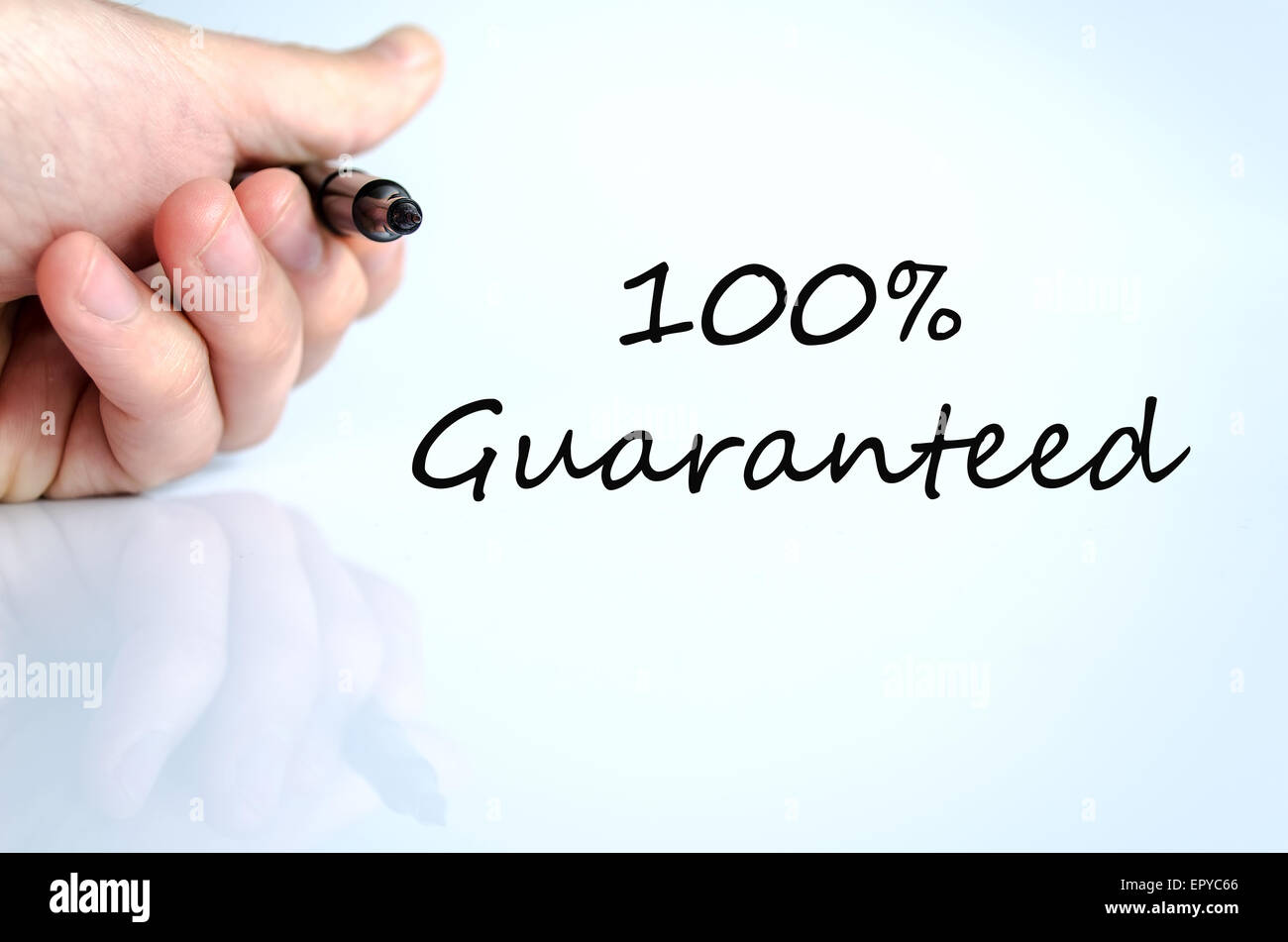 Pen in the hand isolated over white background Guaranteed concept Stock Photo