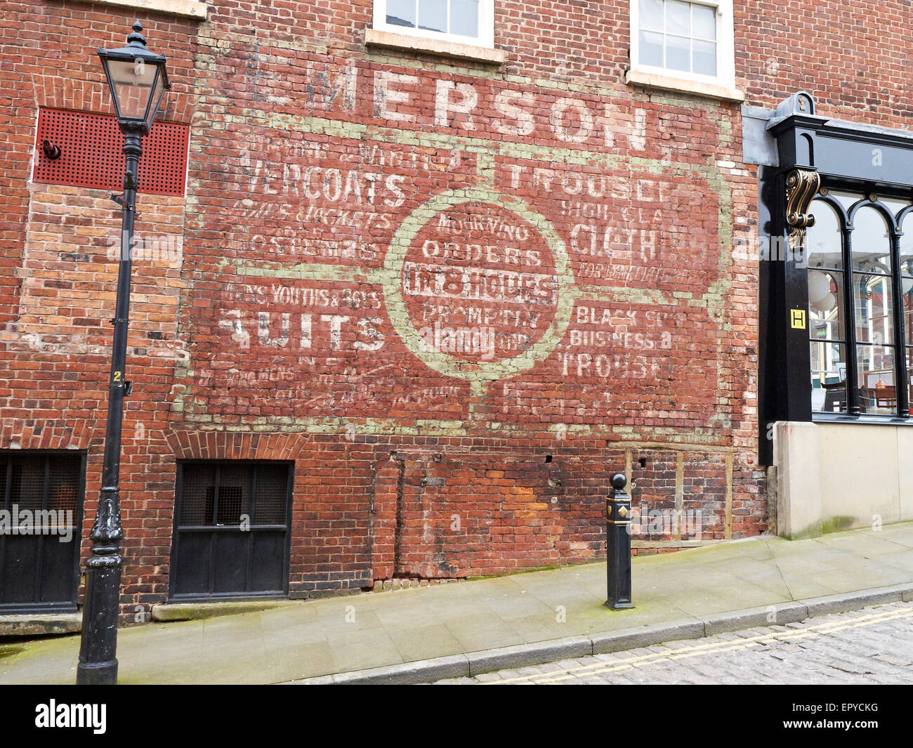 Old fashioned advert on outside shop wall in Stockport UK Stock Photo