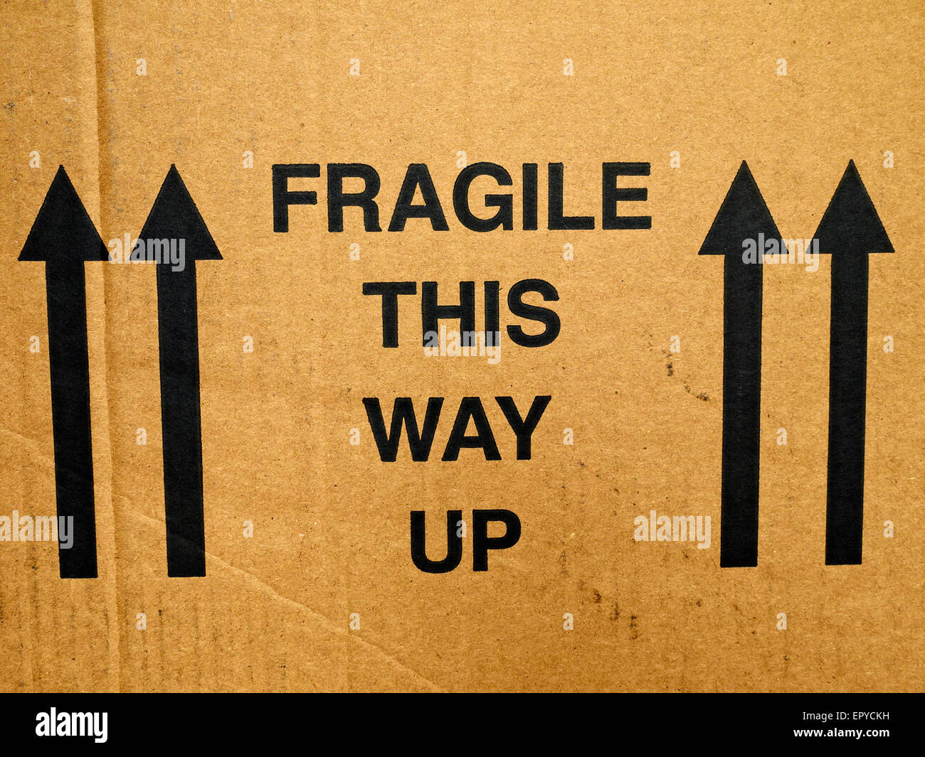 Fragile, This way up warning sign on cardboard box Stock Photo