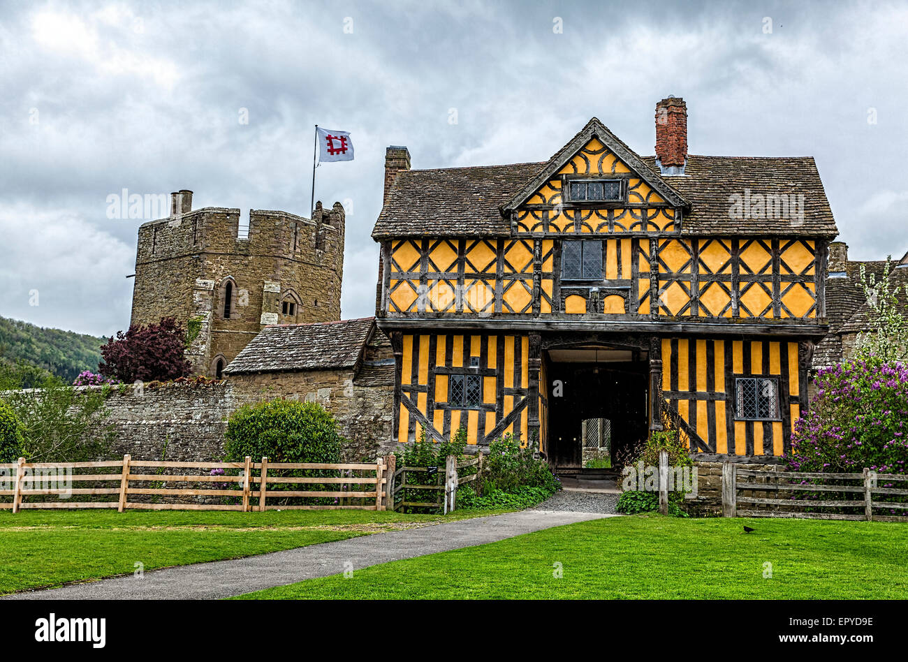 Timber framed gatehouse and stone South Tower at Stokesay Castle in Shropshire maintained by English Heritage Stock Photo