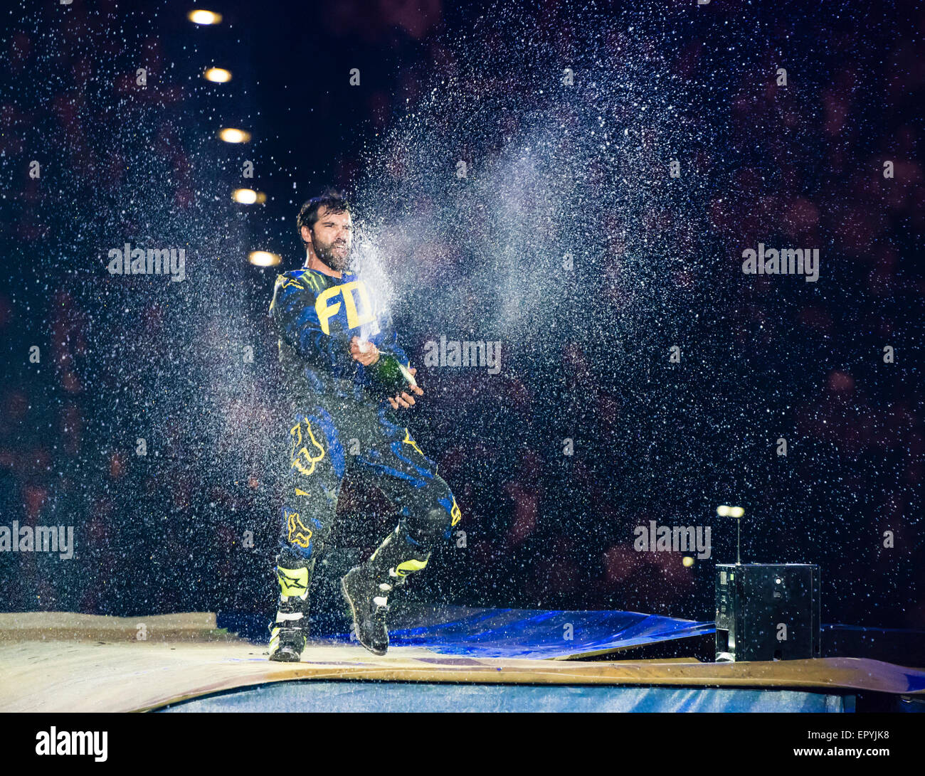 Zurich, Switzerland. 22nd May, 2015. FMX pro Edgar Torronteras sprays champagne after winning the audience voting for best FMX act at the 'Masters of Dirt' freestyle motocross show in Zurich. Credit:  Erik Tham/Alamy Live News Stock Photo