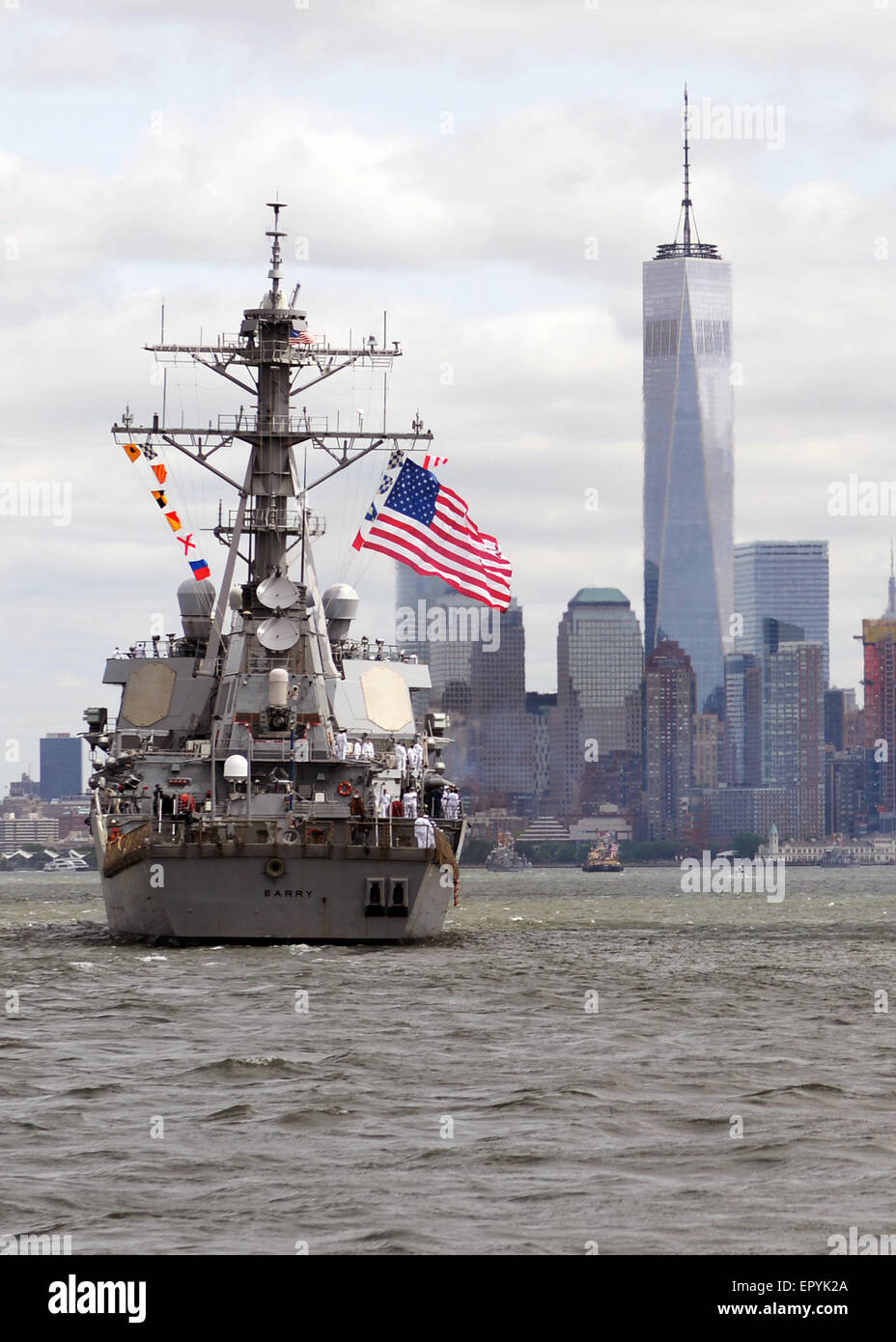 U.S. Navy guided-missile destroyer USS Barry approaches One World Trade Center in downtown Manhattan during the Parade of Ships at Fleet Week May 20, 2015 in New York City, NY. Stock Photo