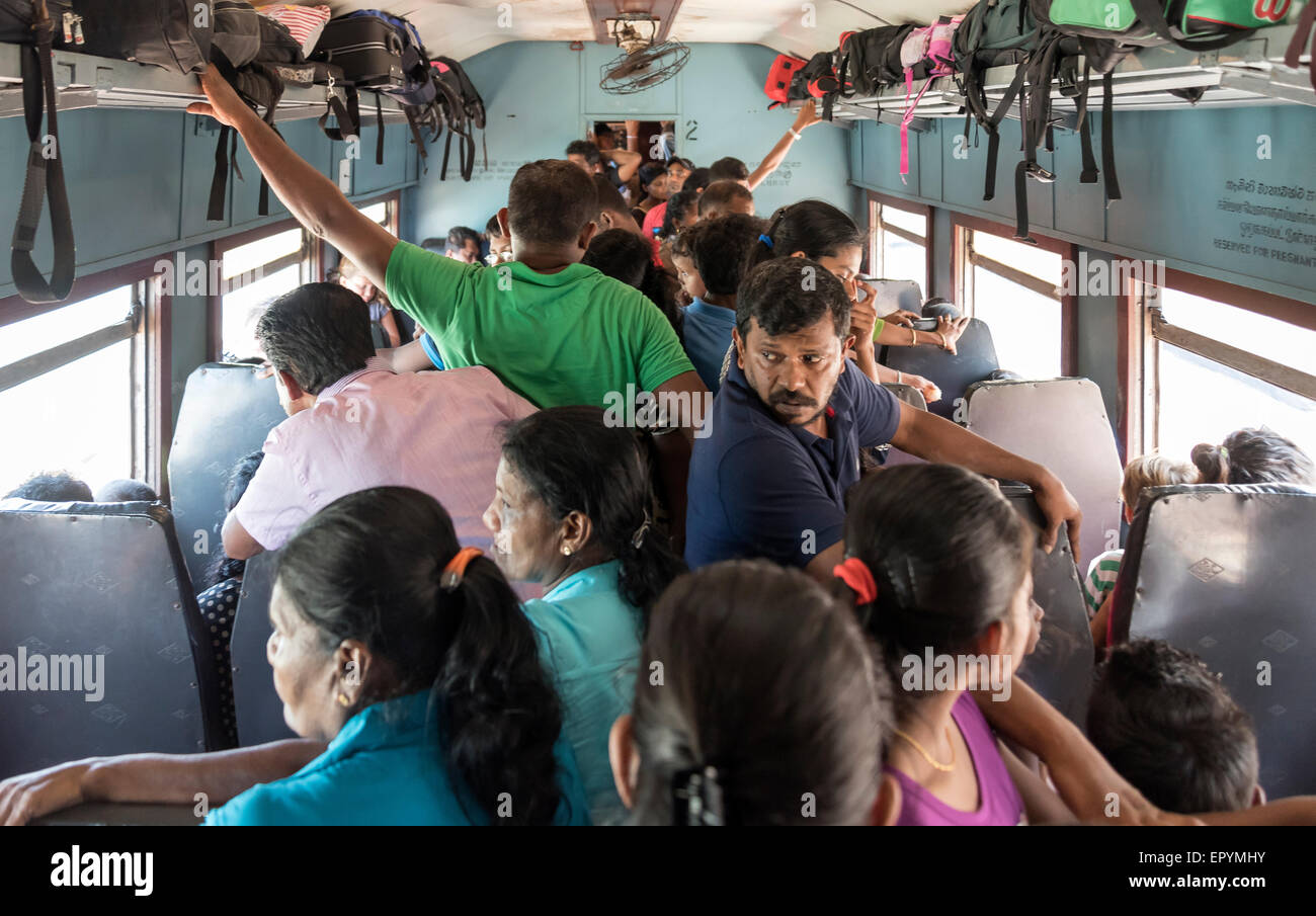 Travelers Stand In Corridor Inside Crowded Train, Sri Lanka Stock Photo
