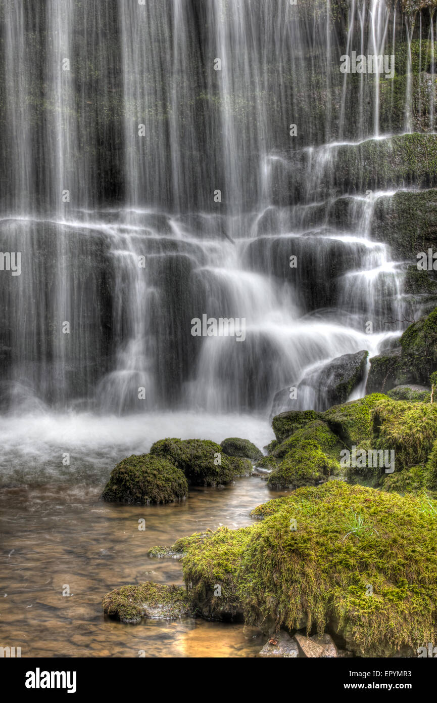 waterfall with moss covered stones in the foreground Stock Photo - Alamy