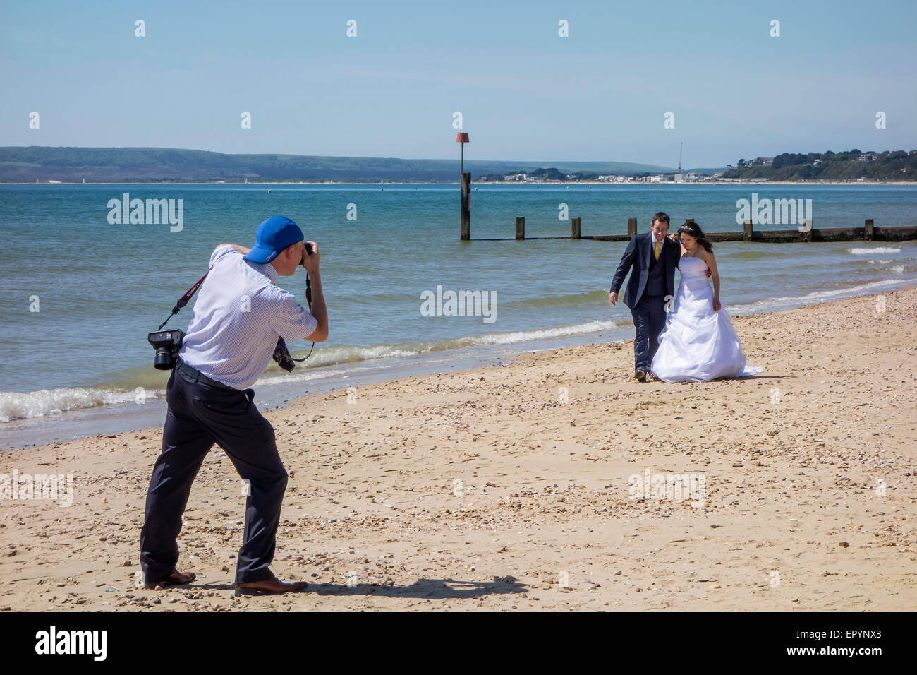 Wedding Photographs being taken on Bournemouth West beach, Dorset, England, UK Stock Photo