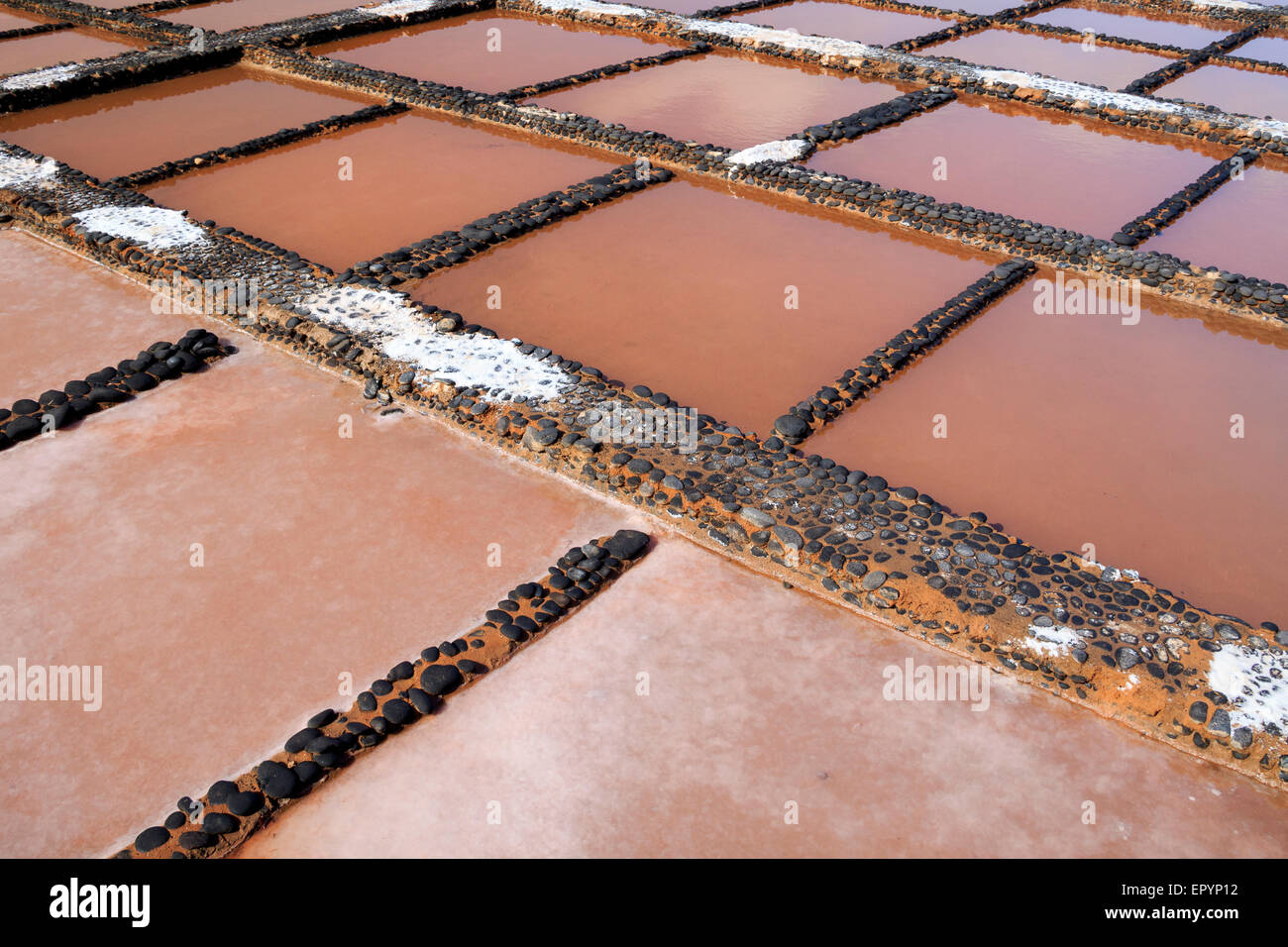 Evaporation ponds for sea salt production Stock Photo Alamy