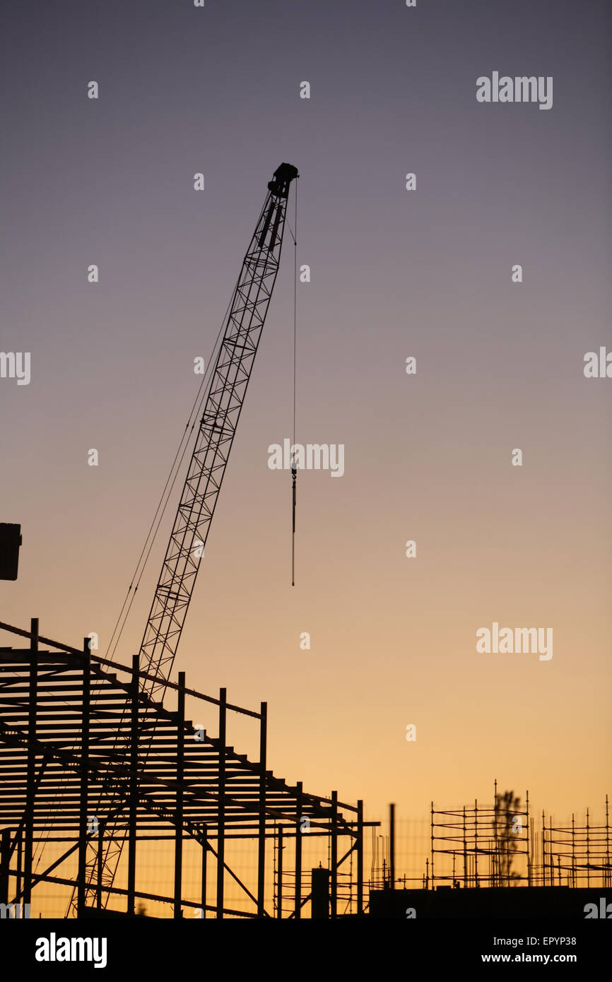 Construction site at dusk Stock Photo - Alamy