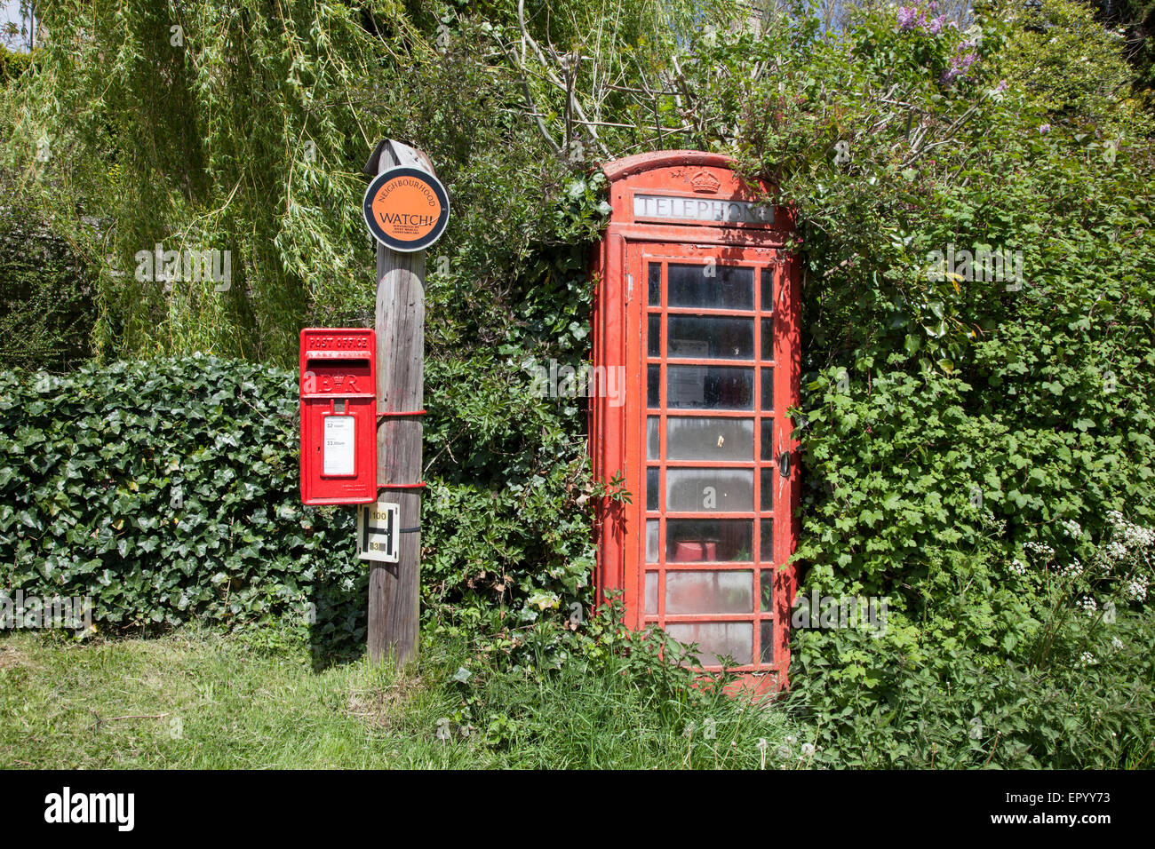 Old red phone box and post box Stock Photo
