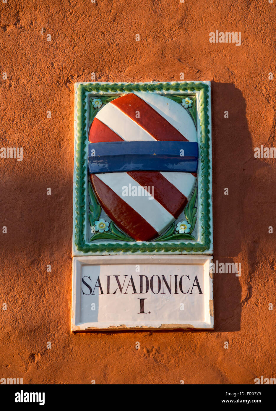 Coat of Arms of Salvadonica, a winery, farm and borgo agricolturismo in Tuscany, lit by the late afternoon sun Stock Photo