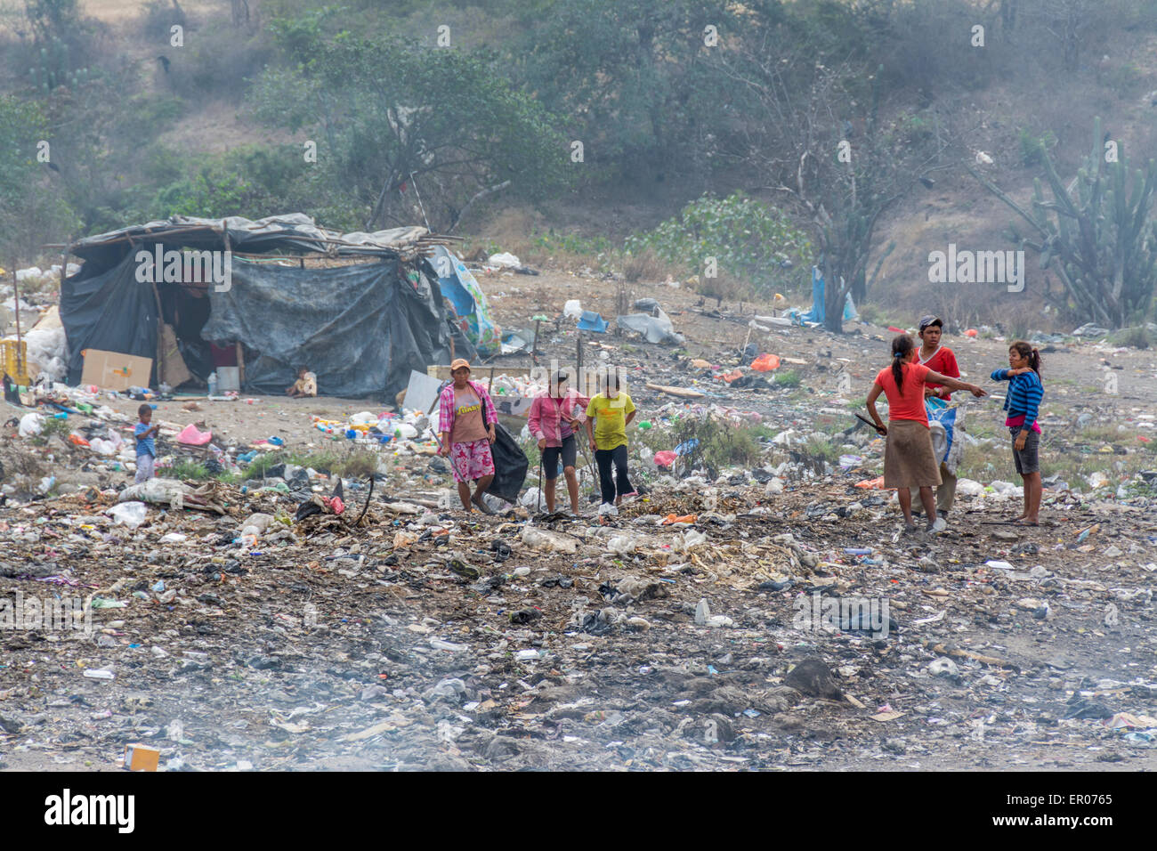 Storage huts for recyclable items being collected by poor people at a garbage dump in Guatemala Stock Photo