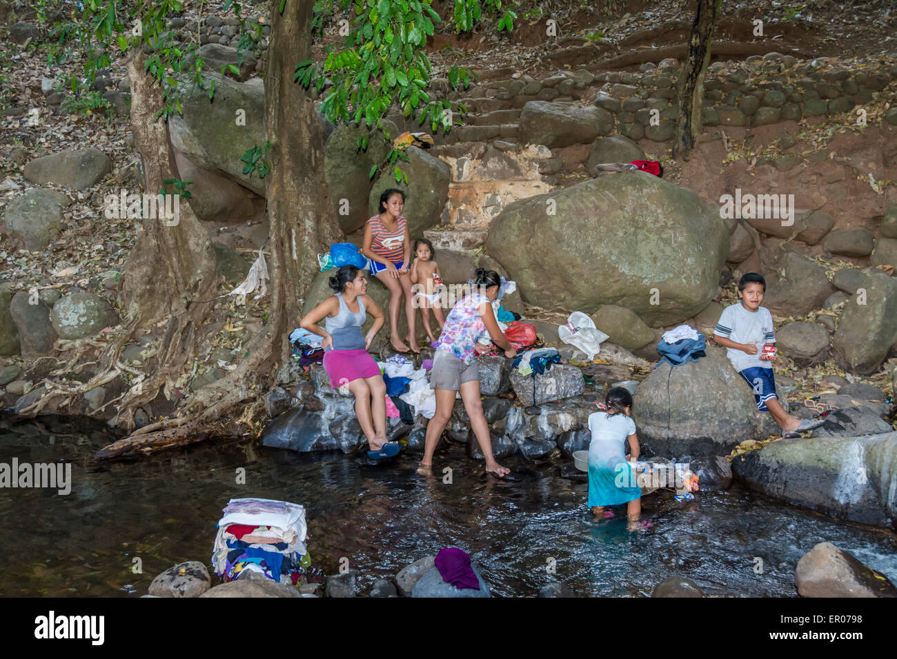 Girl washing in river hi-res stock photography and images - Alamy