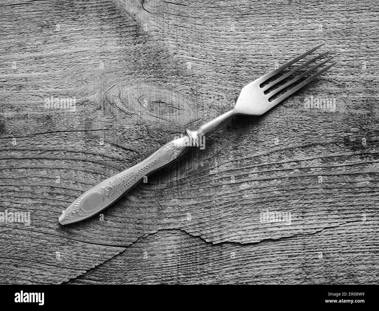Dining fork on raw wooden background. Grunge style. 24th May, 2015. © Igor Golovniov/ZUMA Wire/ZUMAPRESS.com/Alamy Live News Stock Photo