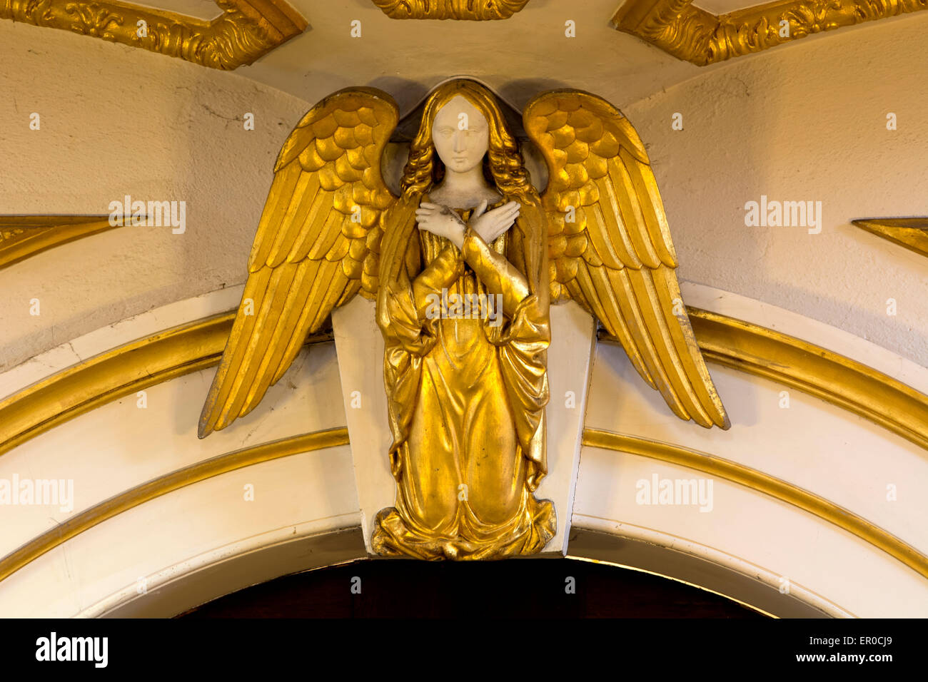 Golden angel above the West Door, St. Michael and All Angels Church, Great Witley, Worcestershire, England, UK Stock Photo