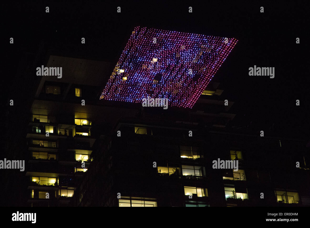 Sydney, Australia. 23 May 2015. Pictured is the heliostat at One Central Park seen lit up from Broadway. For the first time Central Park in Chippendale, Sydney is one of the Vivid festival precincts. On Friday and Saturday nights there is a ‘silent disco’. Credit: Richard Milnes/Alamy Live News Stock Photo