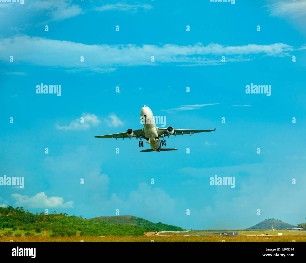 Airplane take-of from Phuket International airport Stock Photo
