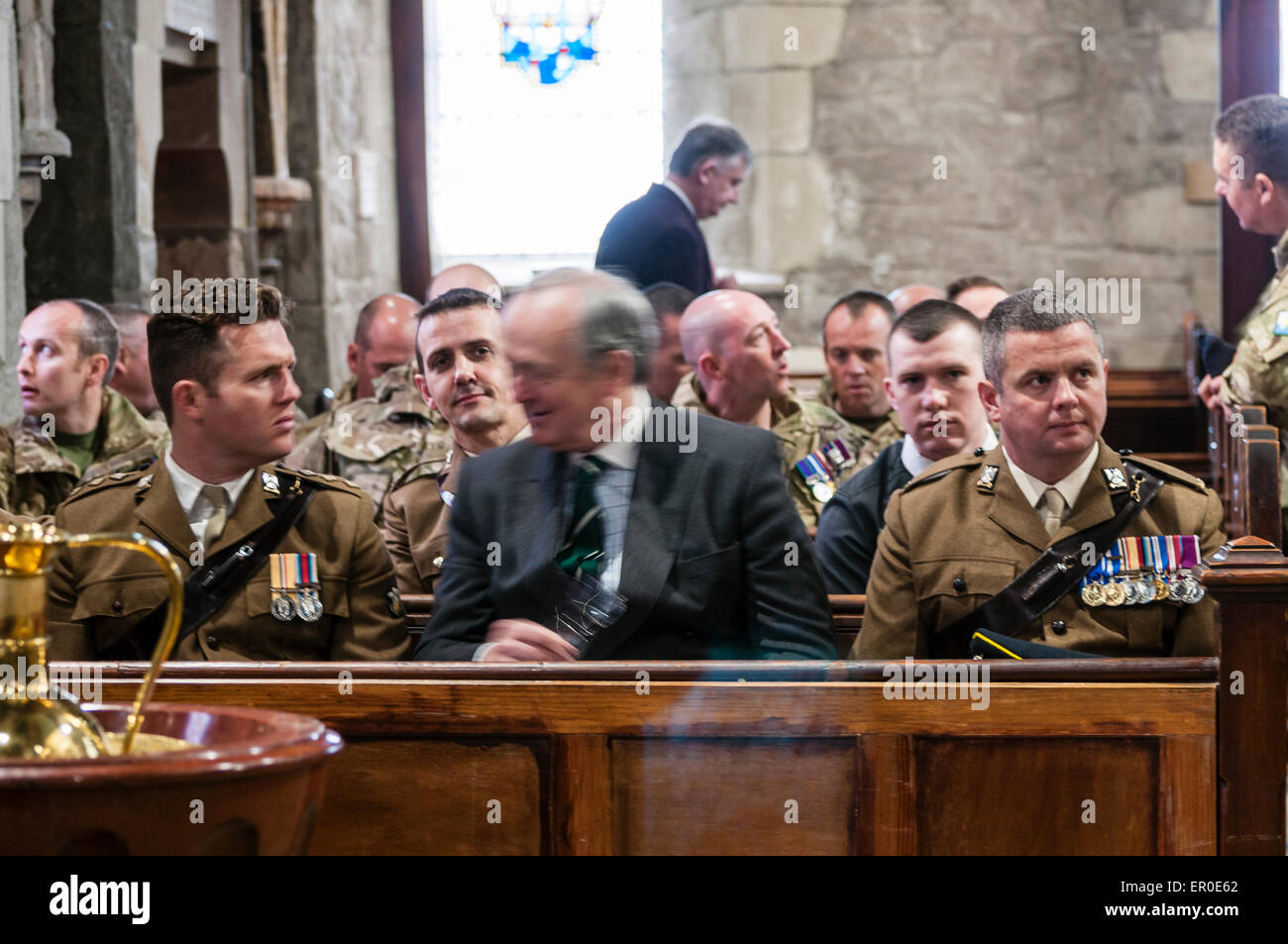 Carrickfergus, Northern Ireland. 23rd May, 2015. Soldiers sitting in pews in an old church Credit:  Stephen Barnes/Alamy Live News Stock Photo