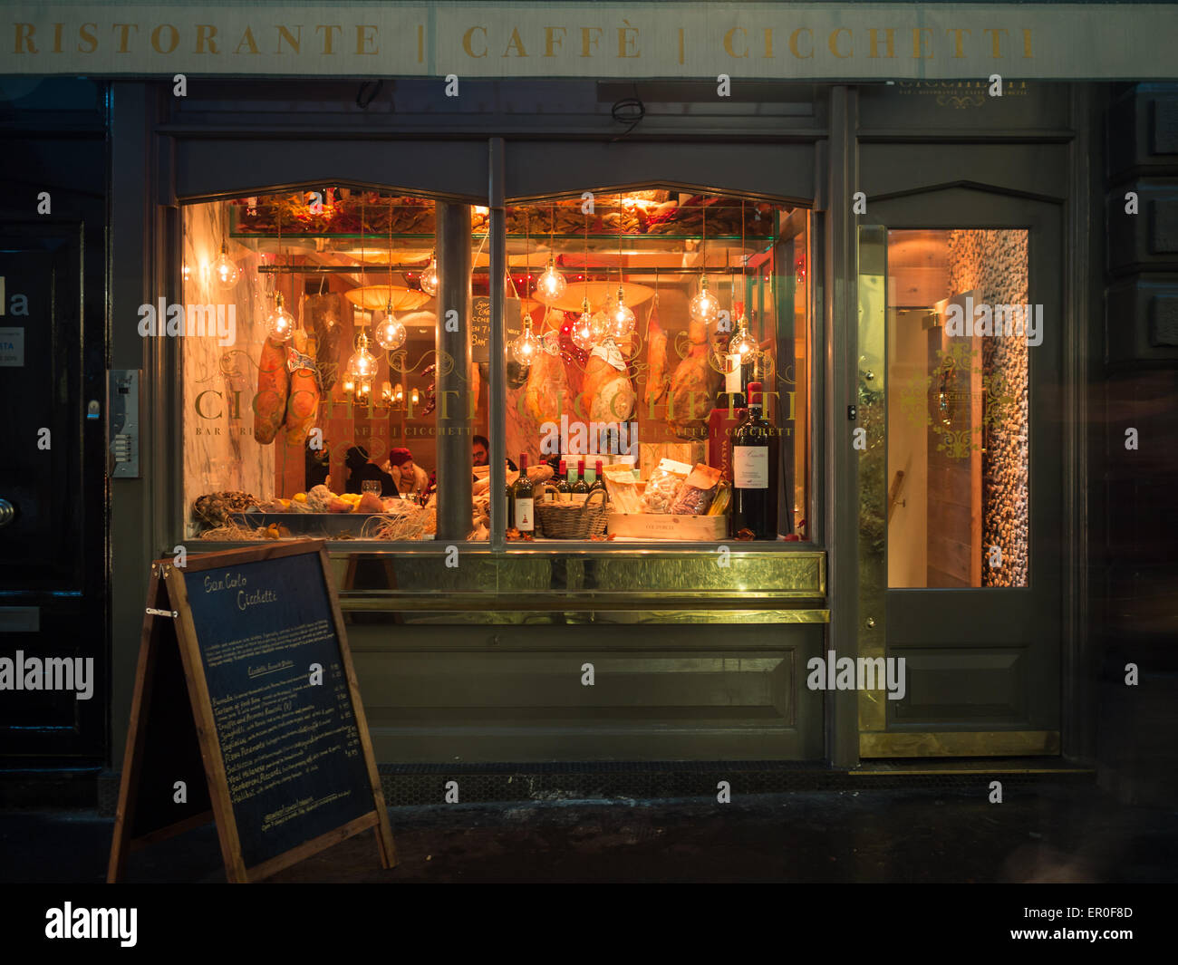 Night shot of a London Italian restaurant facade Stock Photo