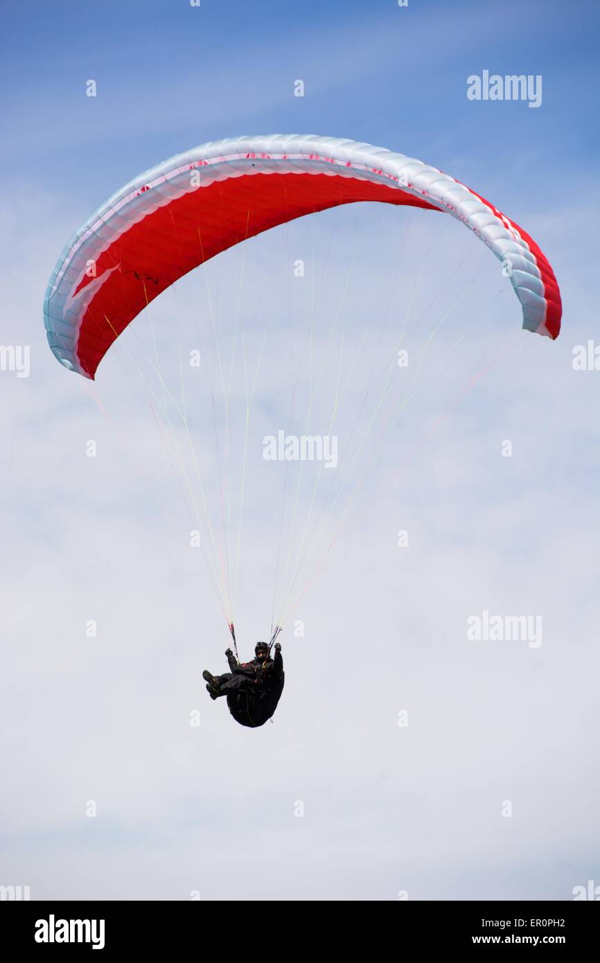 A paraglider pilot soars in the sky Stock Photo Alamy
