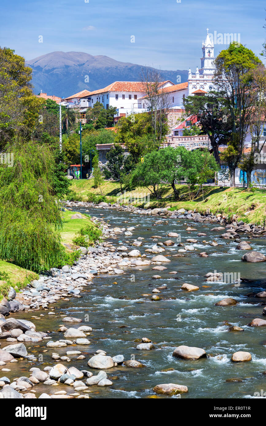 View of a church in Cuenca, Ecuador with the Tomebamba River in the foreground Stock Photo