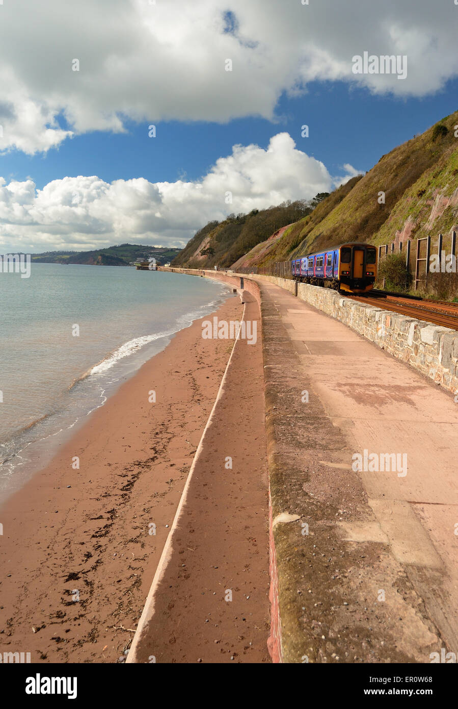 Railway line along the sea wall, where it is exposed to regular damage from storms and high tides. Stock Photo