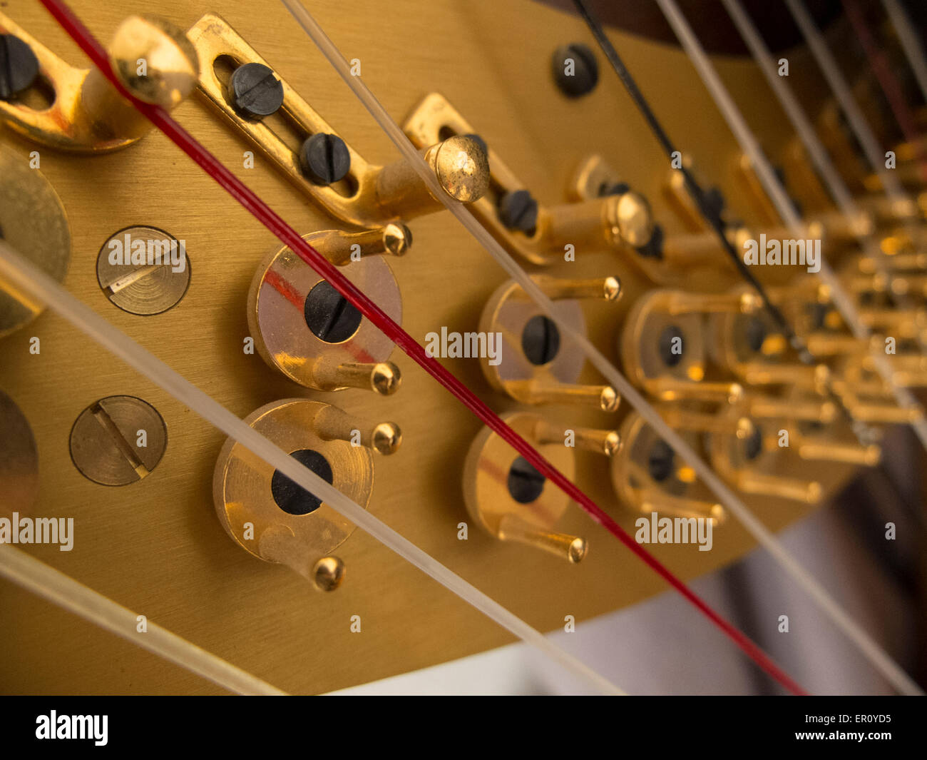 Hardware for adjusting the tension of harp stings Stock Photo - Alamy