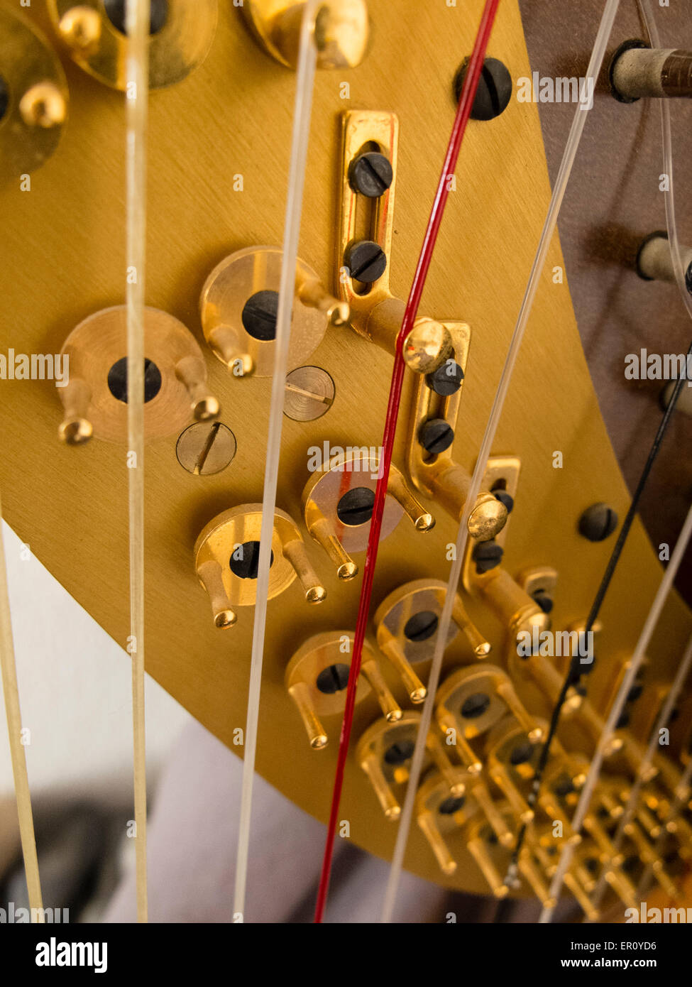Hardware for adjusting the tension of harp stings Stock Photo - Alamy