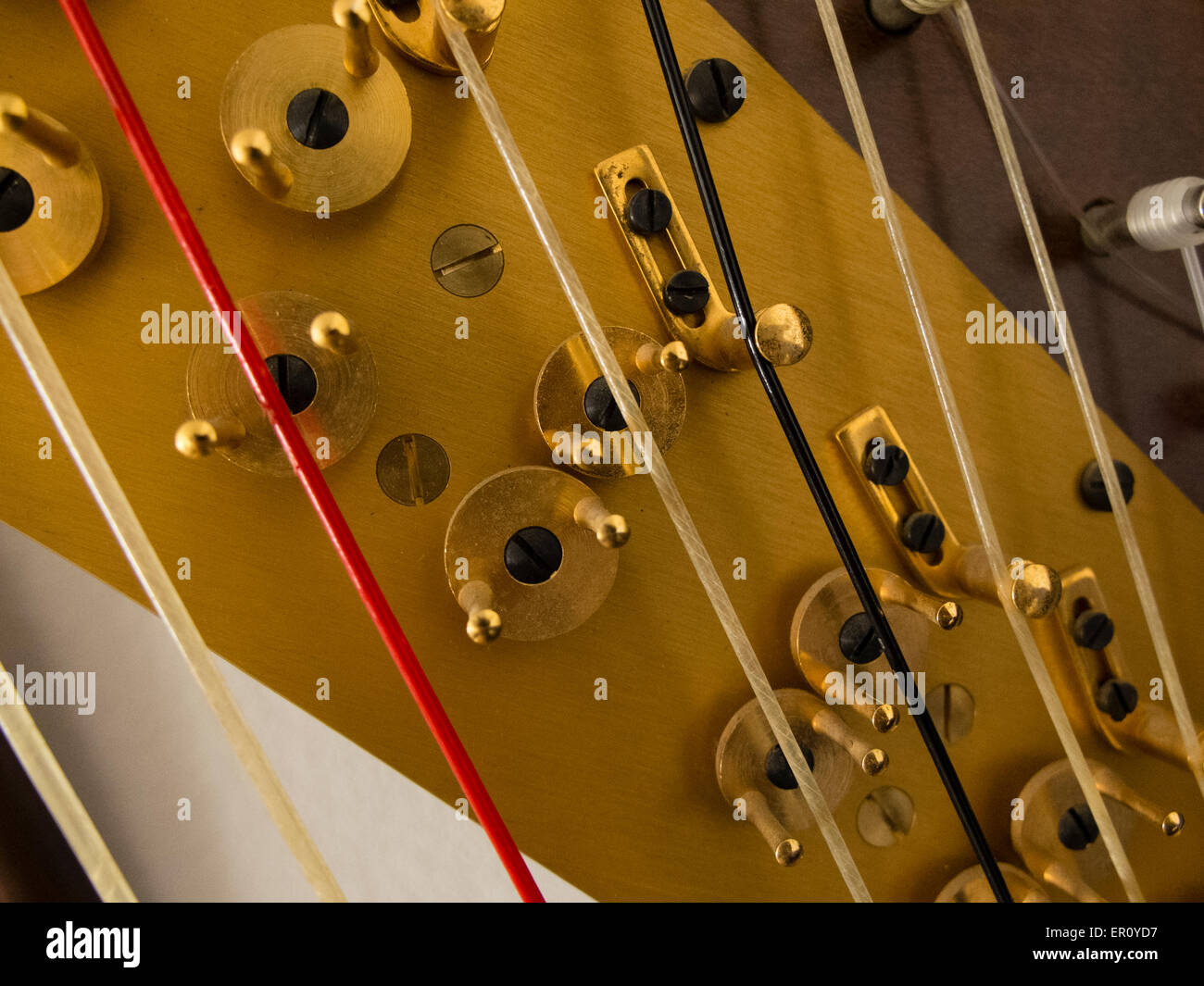 Hardware for adjusting the tension of harp stings Stock Photo - Alamy