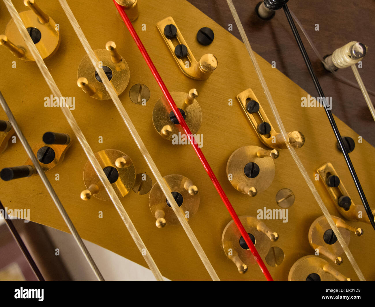 Hardware for adjusting the tension of harp stings Stock Photo - Alamy