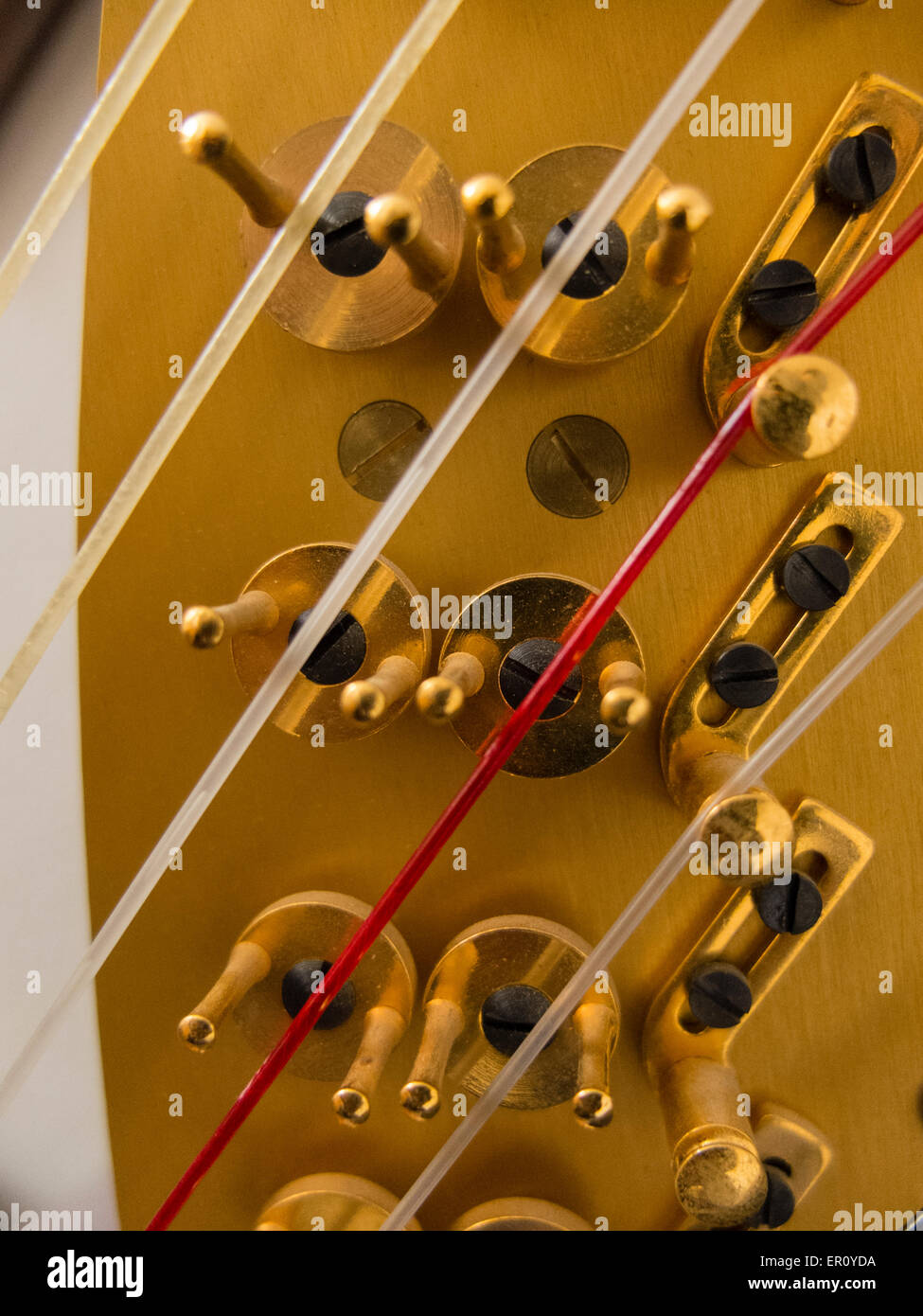 Hardware for adjusting the tension of harp stings Stock Photo - Alamy