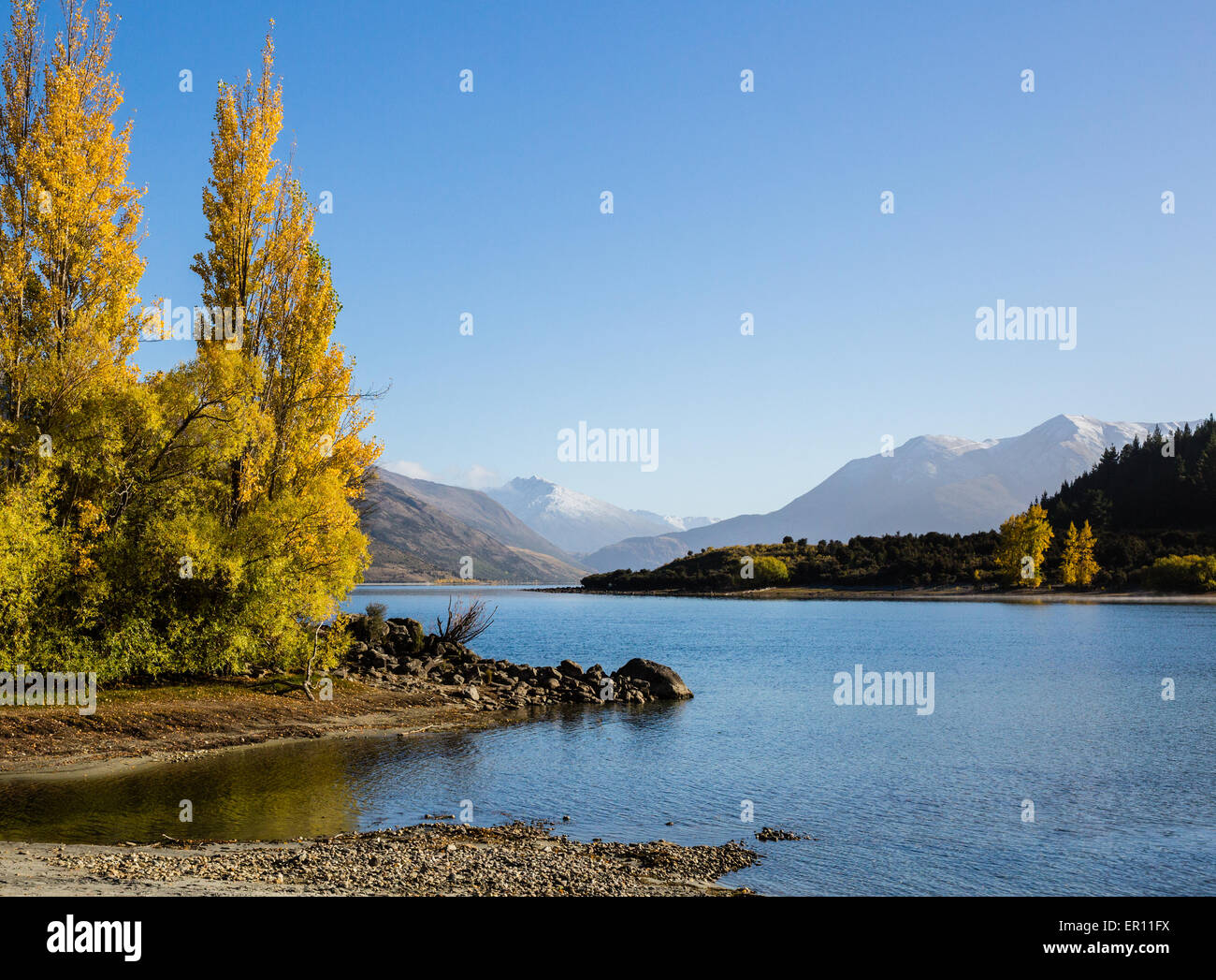 Lake Wanaka outlet in autumn with views to Mount Aspiring in South Island New Zealand Stock Photo