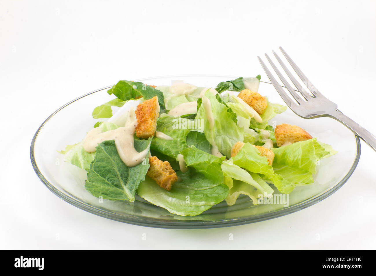 Caesar salad with thick creamy dressing isolated on white background Stock Photo Alamy
