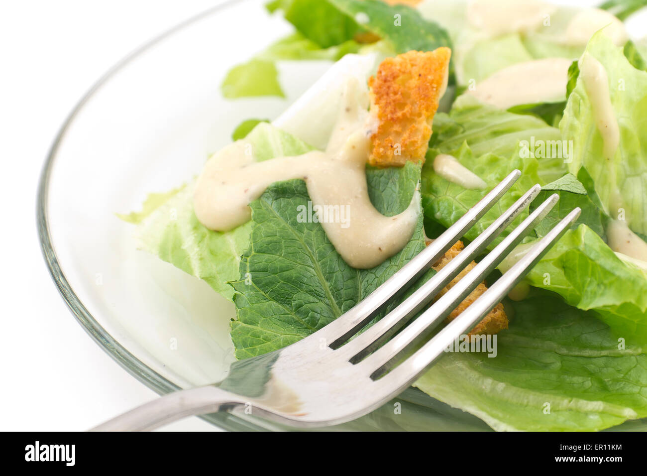 Caesar salad with thick creamy dressing isolated on white background Stock Photo Alamy
