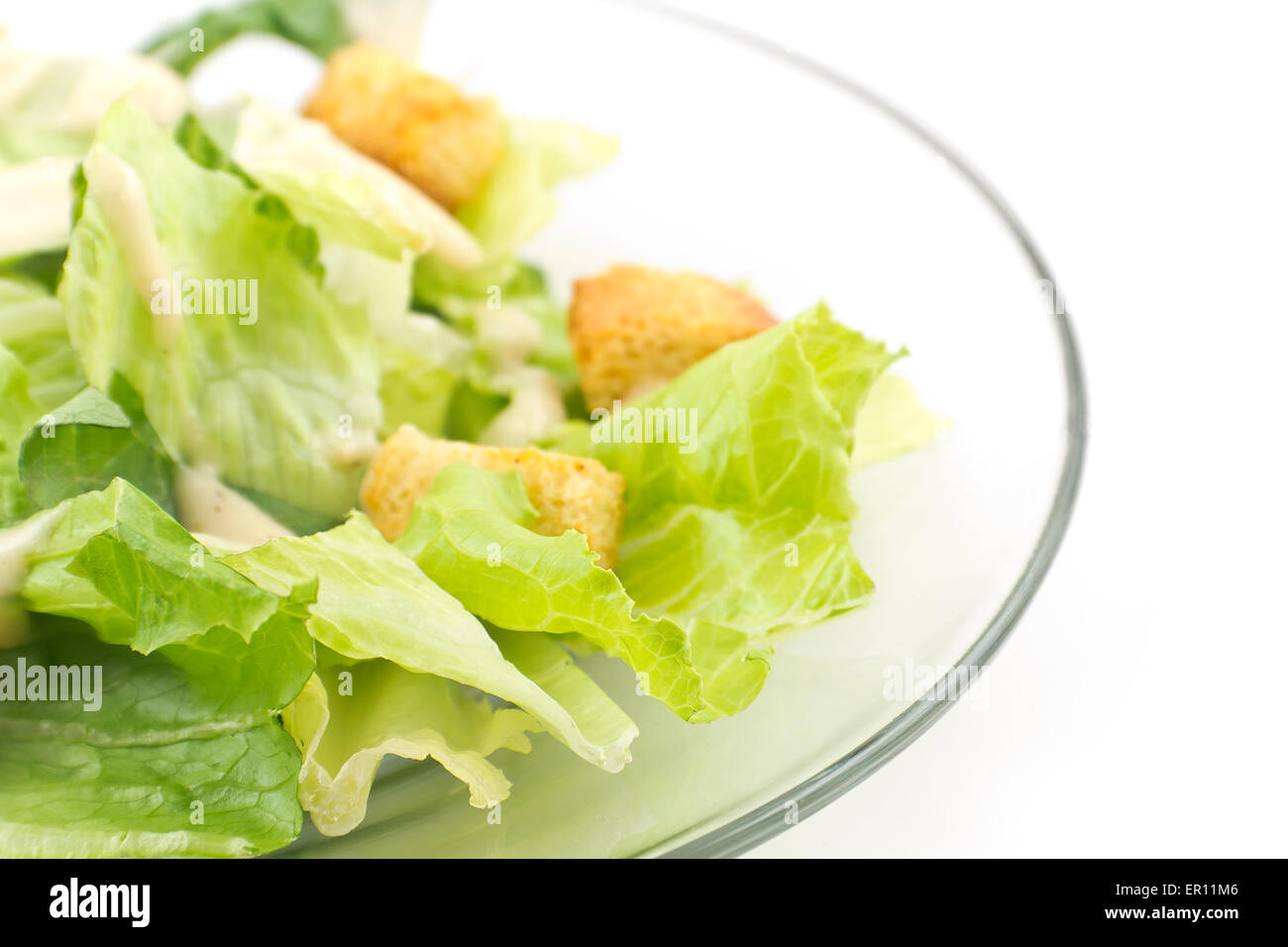 Caesar salad with thick creamy dressing isolated on white background Stock Photo Alamy