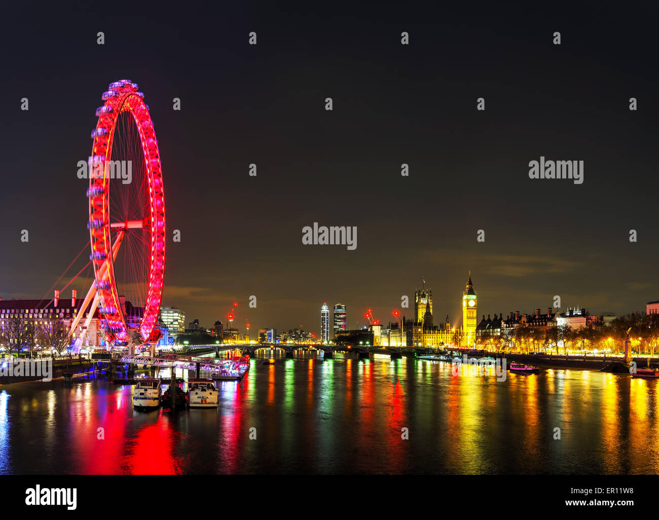 LONDON - APRIL 5: Overview of London with the Coca-Cola London Eye on April 5, 2015 in London, UK. The entire structure is 135 m Stock Photo