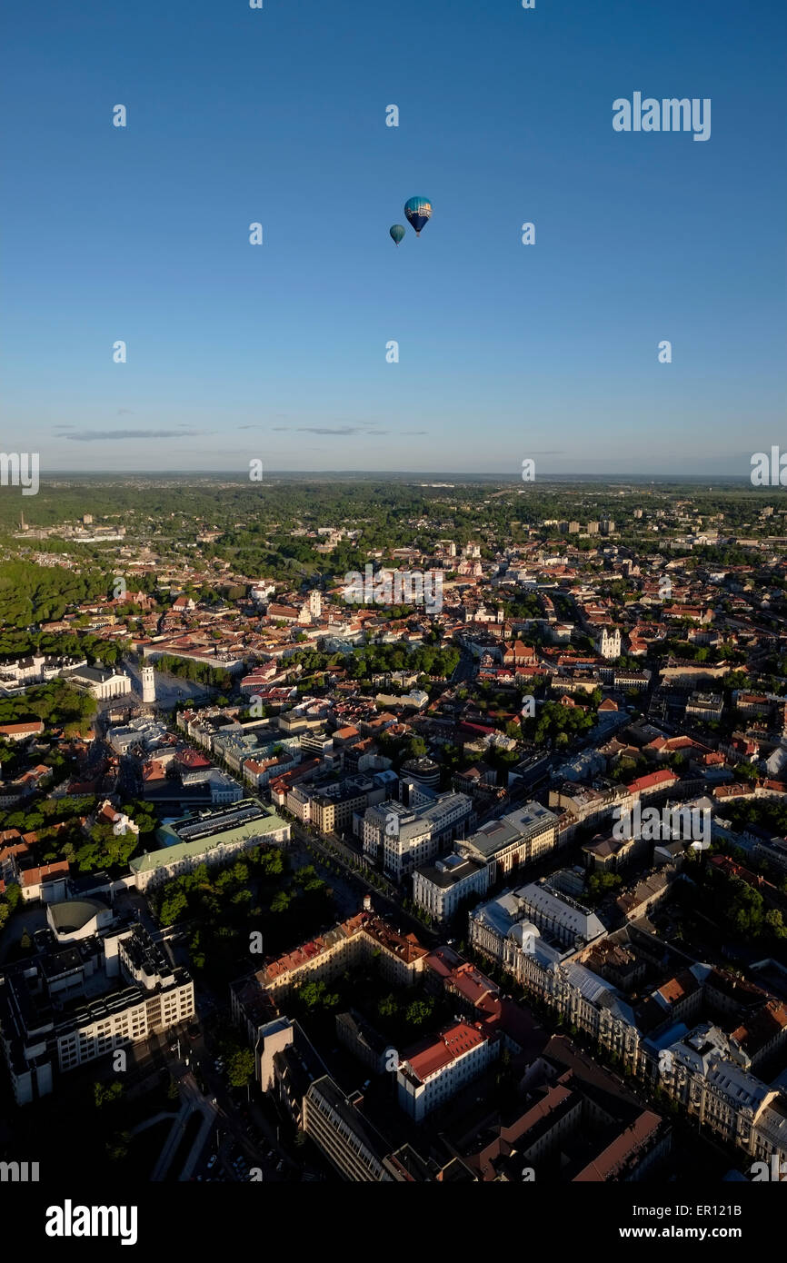 Hot air ballooning over the old town of Vilnius a UNESCO World Heritage Site and capital of Lithuania. Stock Photo