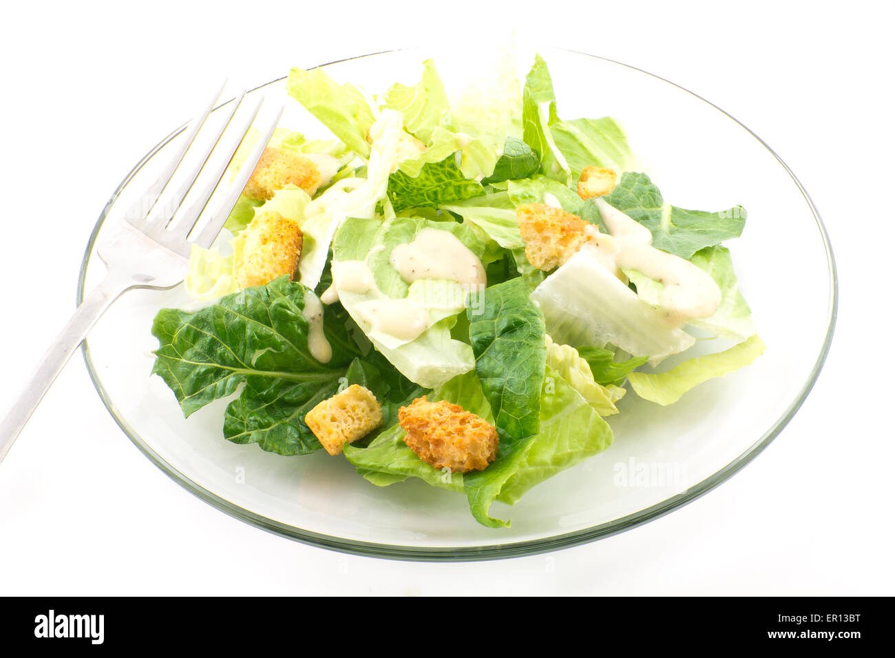 Caesar salad with thick creamy dressing isolated on white background Stock Photo Alamy