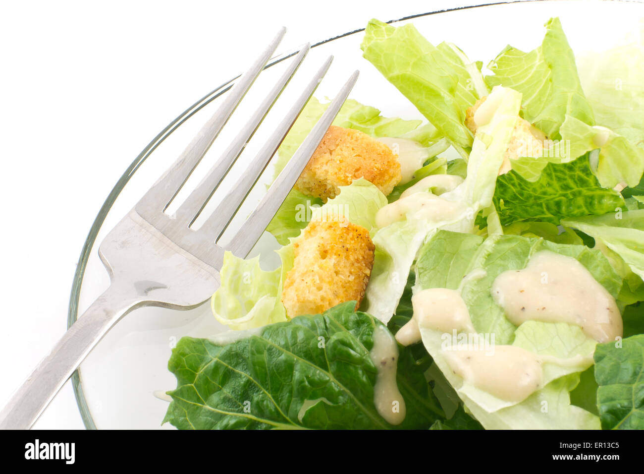 Caesar salad with thick creamy dressing isolated on white background Stock Photo Alamy