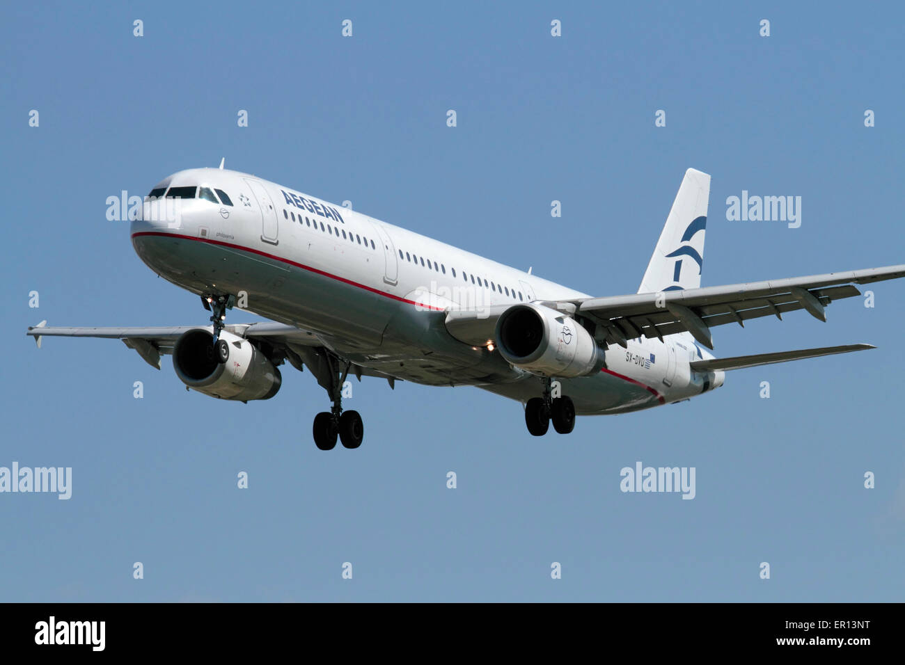 Commercial air travel. Aegean Airlines Airbus A321 commercial passenger jet plane on approach. Quarter front view. Stock Photo
