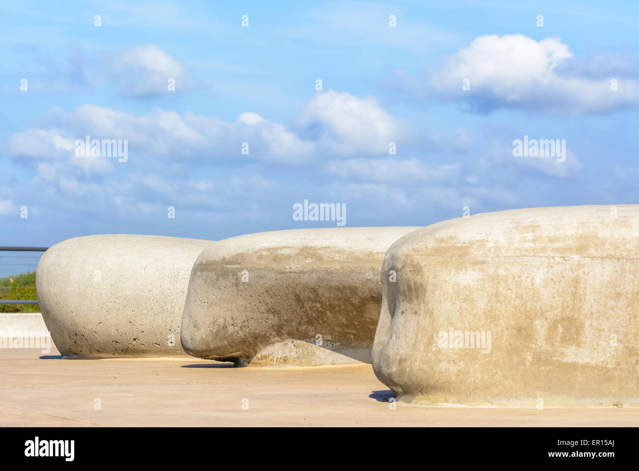 Sculpted stone seats on the seafront promenade at Littlehampton, West Sussex, England, UK. Stock Photo