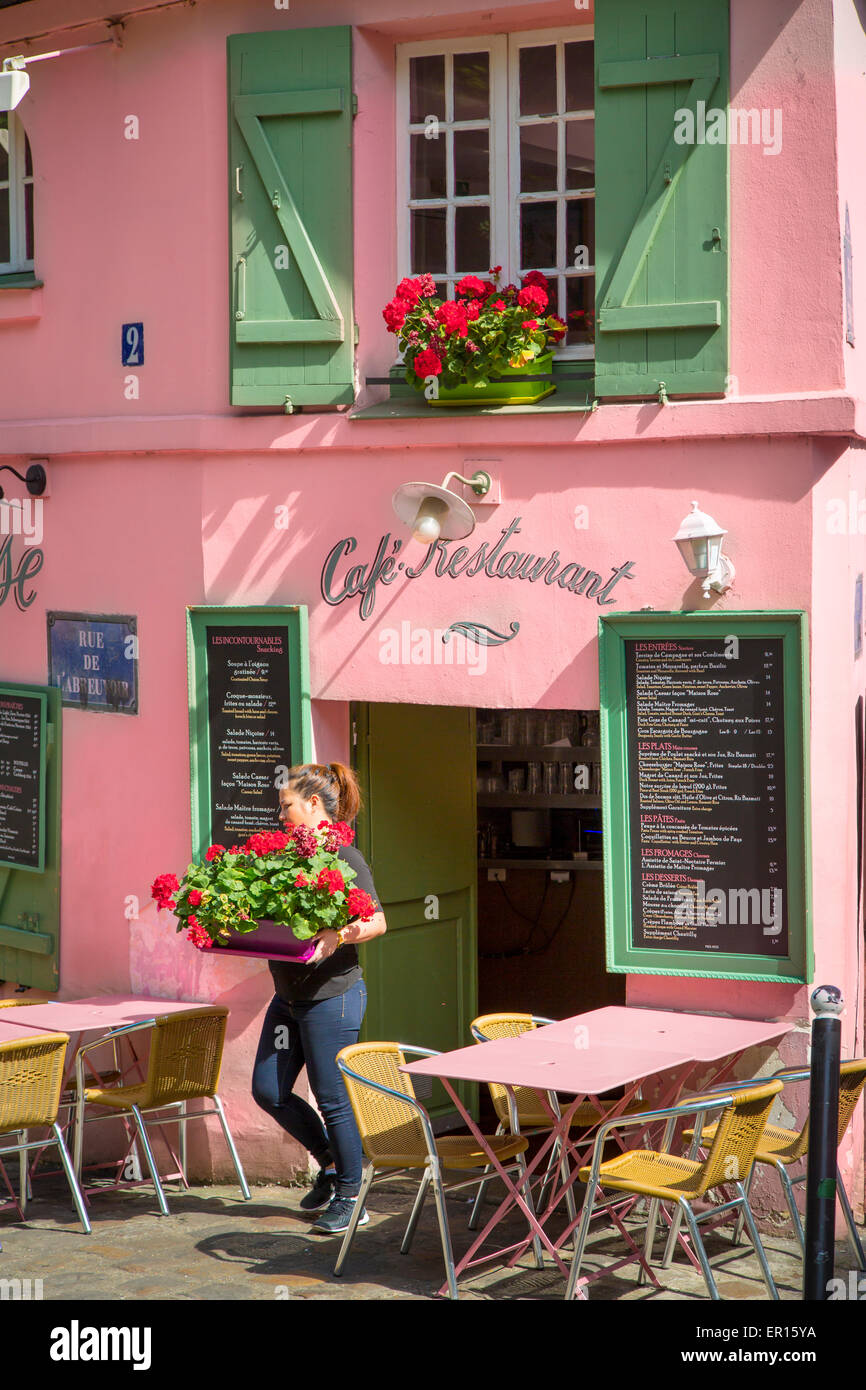 Setting flowers out at Cafe Maison Rose, Montmartre, Paris, France Stock Photo