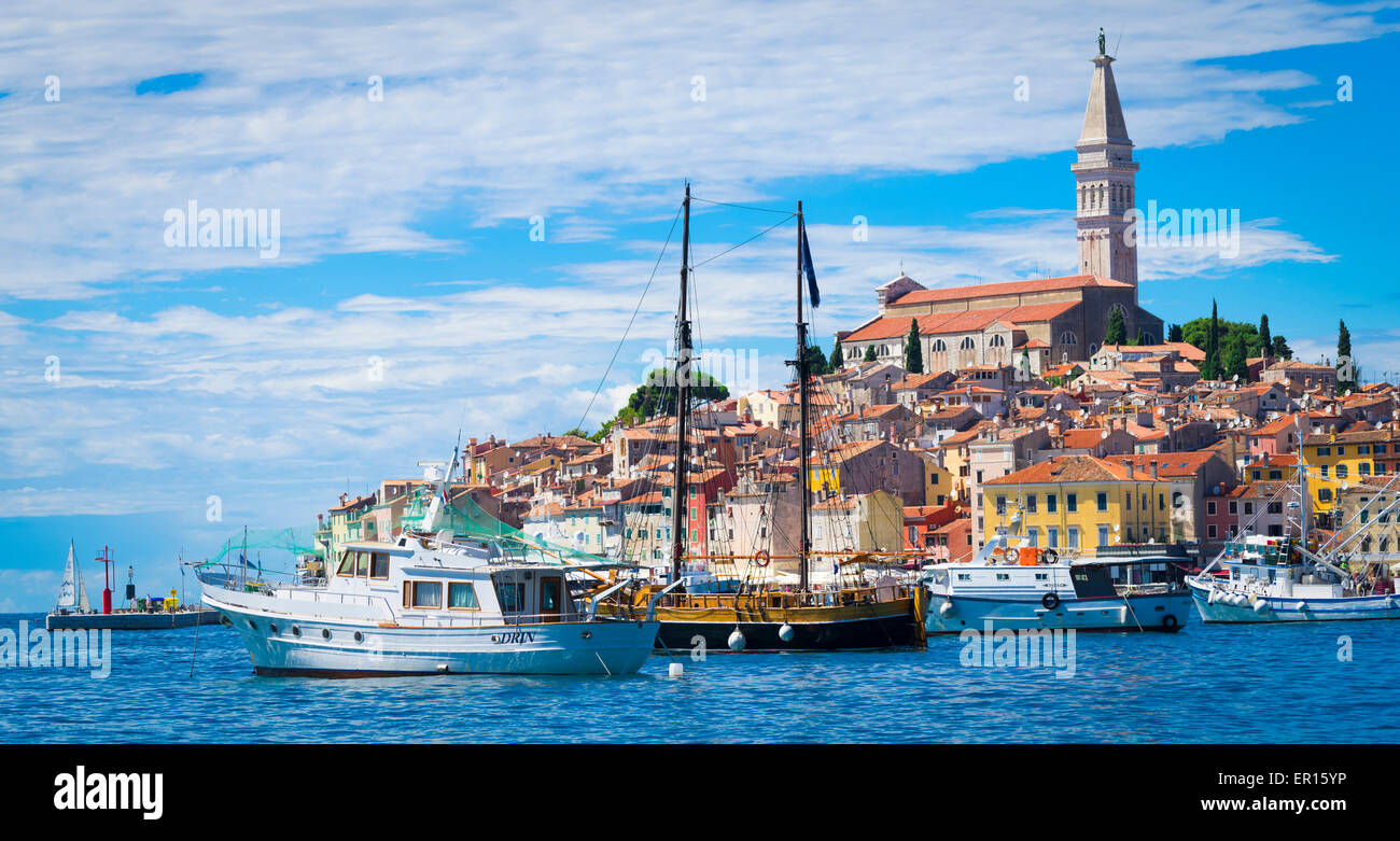 Summer Morning with the sun shinning on the old town of Rovinj in Croatia on the Adriatic coast with the campanile standing out. Stock Photo