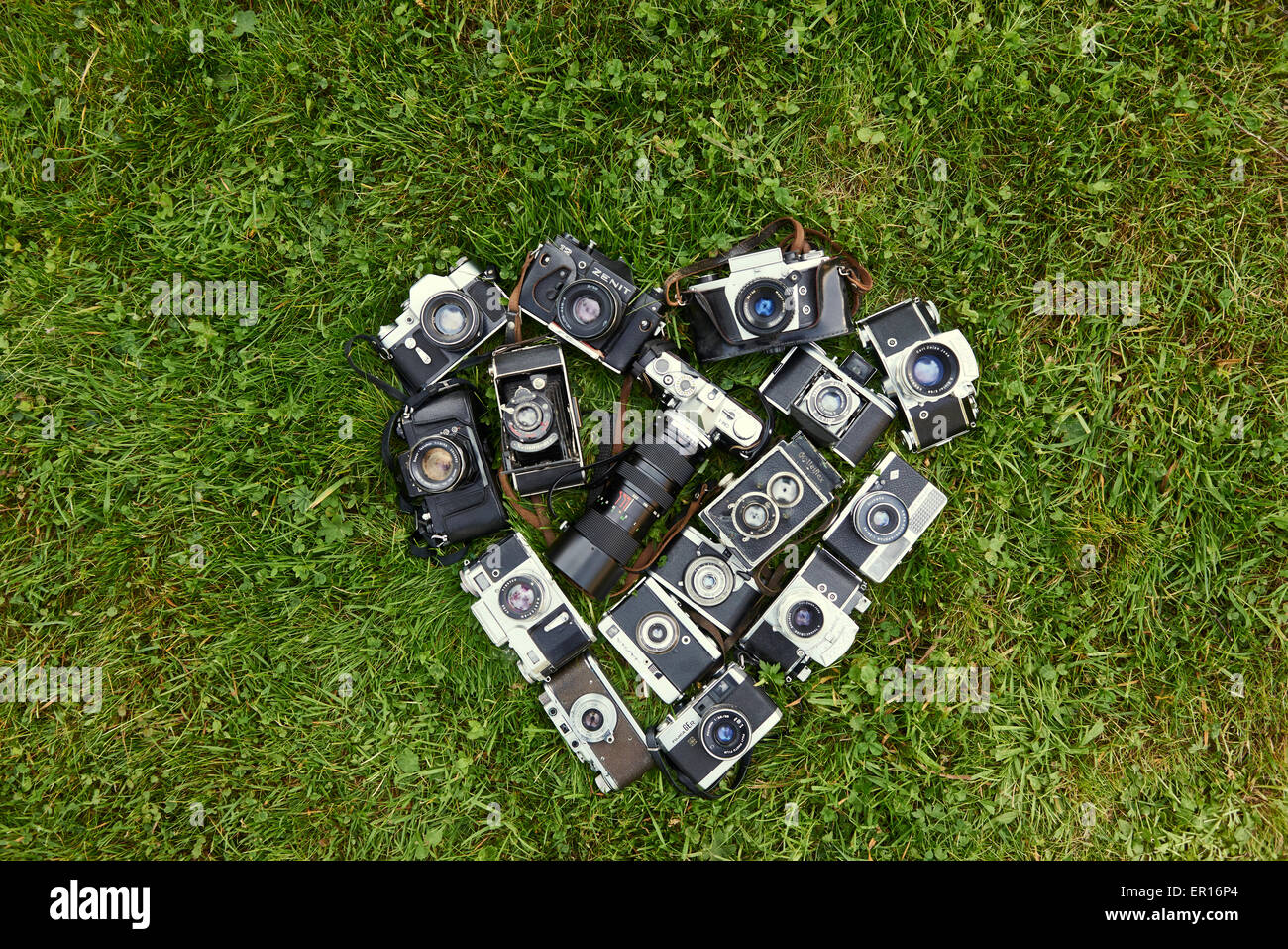 Heart shape made by collection of old retro film cameras, lying on ...
