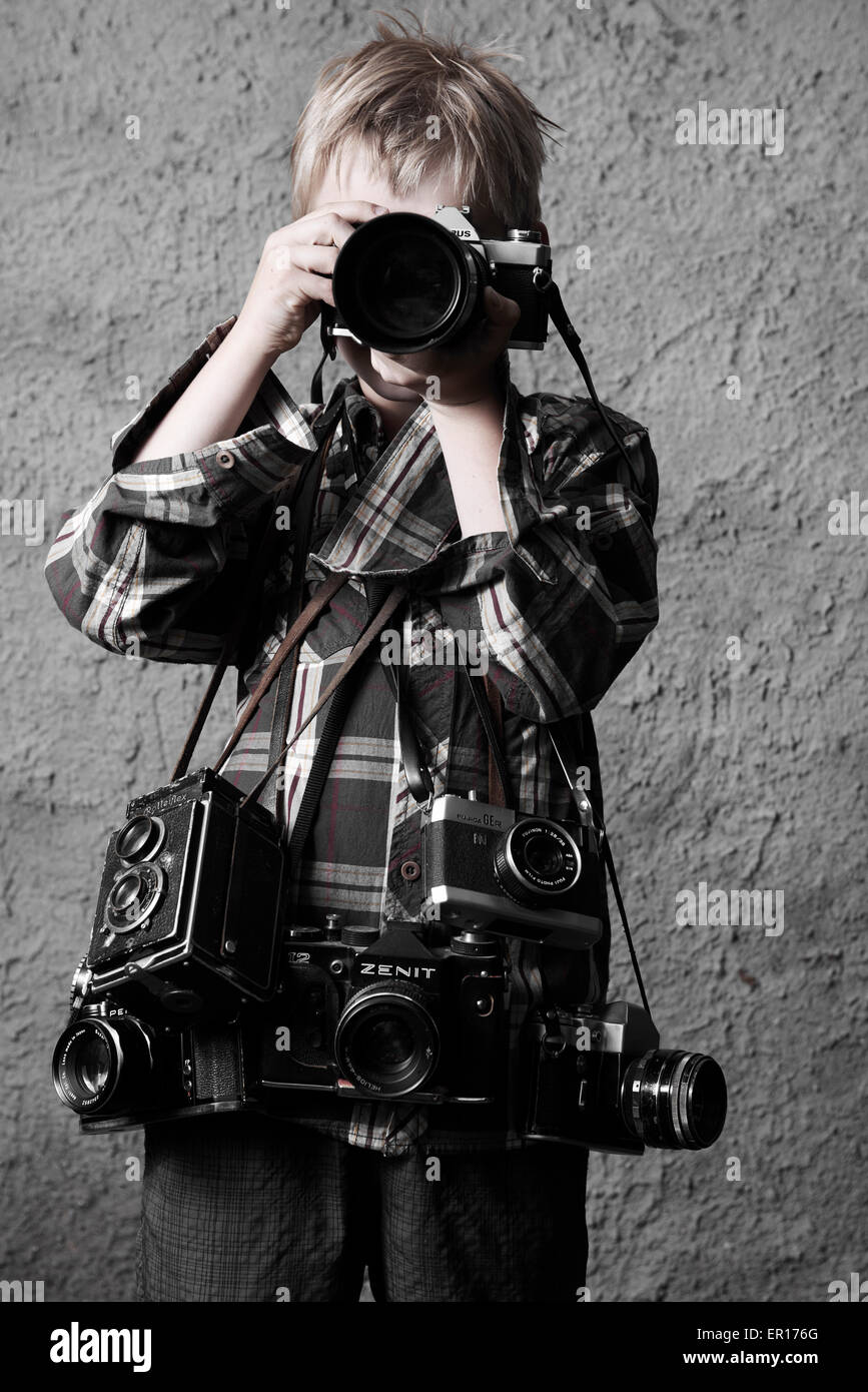 Child boy with Vintage photo film retro camera photographing and many ...