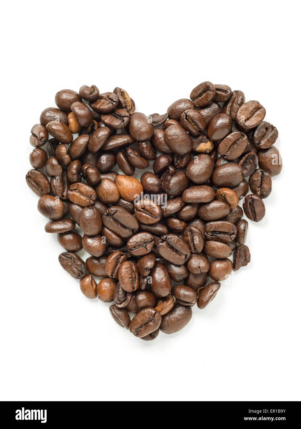 heap of roasted coffee beans in shape of heart isolated on white Stock Photo